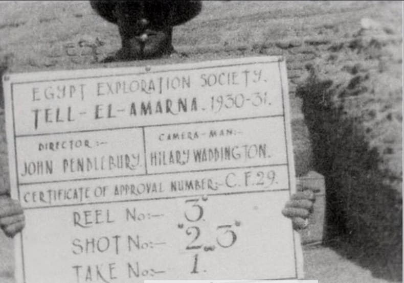 Hilary Waddington holding the ‘clapper board’ used in the filming of the Amarna footage, donated to the EES in summer 2015 by Edward and Samantha Waddington