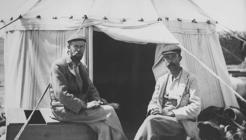 Grenfell and Hunt sit outside their tent during a Graeco-Roman Branch expedition to the Faiyum